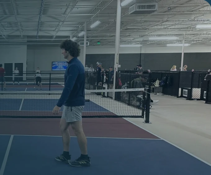 Eli on the pickleball court at Club 65